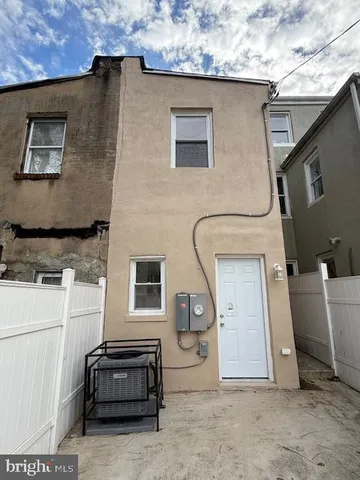 a front view of a house with parking