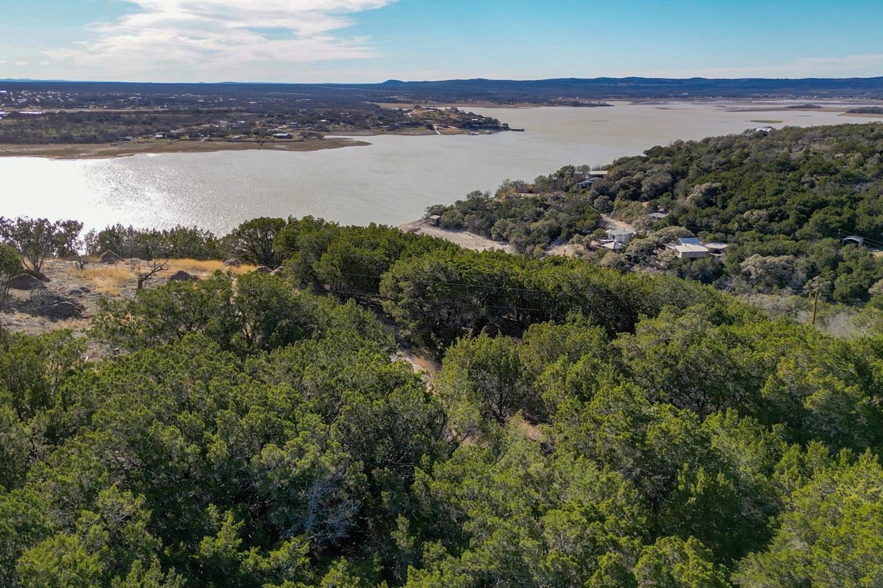 1007 Ed Low Drive Burnet, TX 78611 - Photo 1 of 15 a view of a lake and mountain in the back