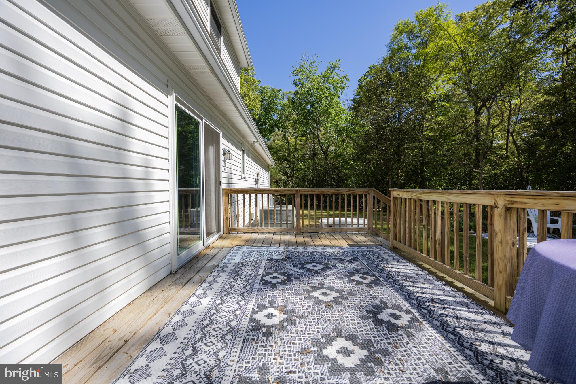 10958 Pit Road Seaford, DE 19973 - Photo 50 of 56 Serene deck overlooking lush greenery.
