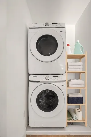 a kitchen with stainless steel appliances white cabinets and a sink