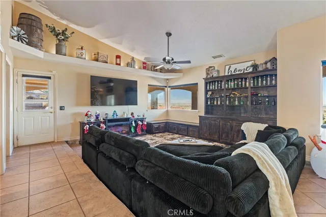 a view of a room with furniture and windows