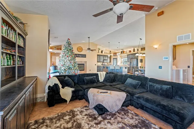 a view of a dining room with furniture and a chandelier
