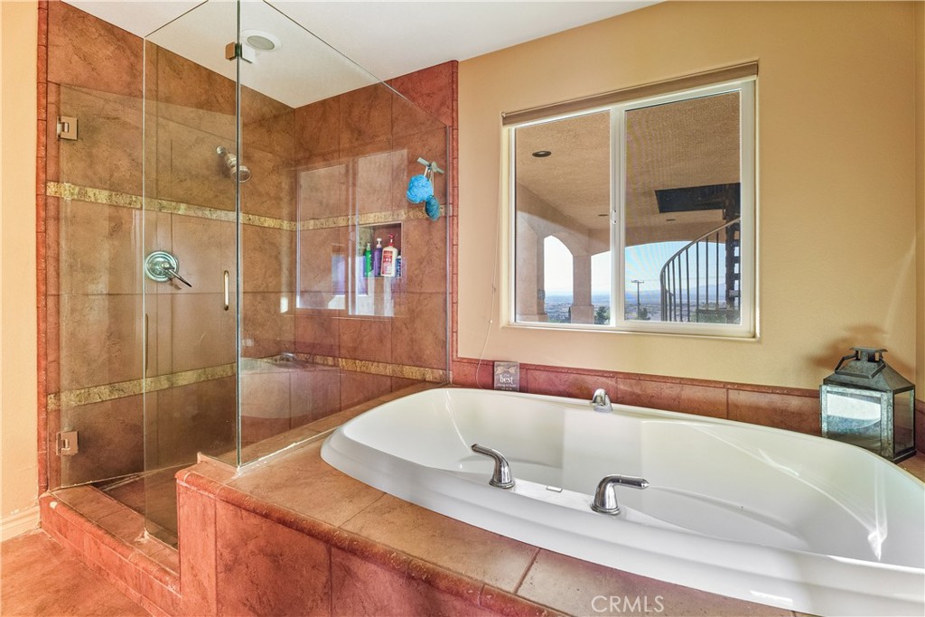 23053 Roundup Way Apple Valley, CA 92308 - Photo 27 of 46 a bathroom with a tub and a sink