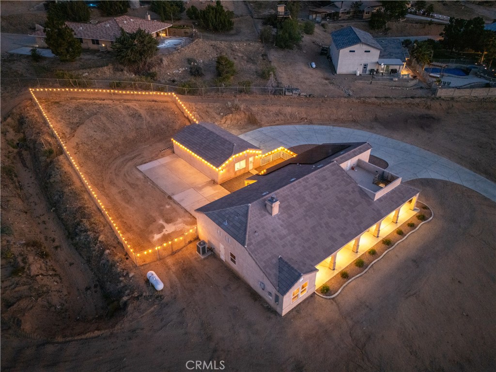 23053 Roundup Way Apple Valley, CA 92308 - Photo 41 of 46 an aerial view of a house with a swimming pool