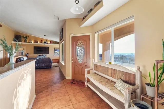 a kitchen with stainless steel appliances granite countertop a sink refrigerator and cabinets