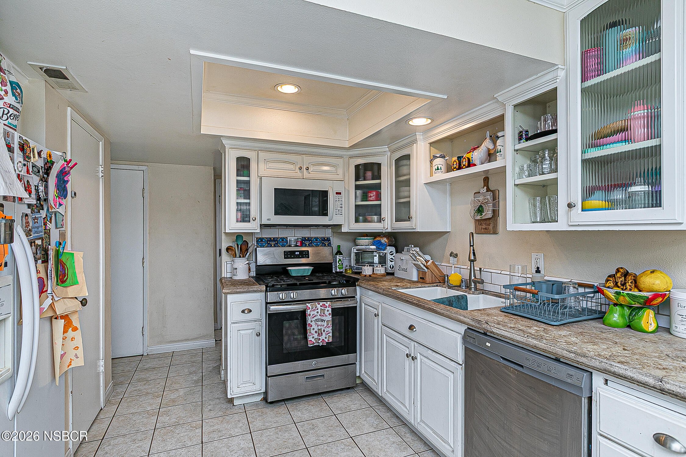 712 Pebble Beach Place Santa Maria, CA 93454 - Photo 10 of 31 a kitchen with stainless steel appliances granite countertop a refrigerator and a stove top oven