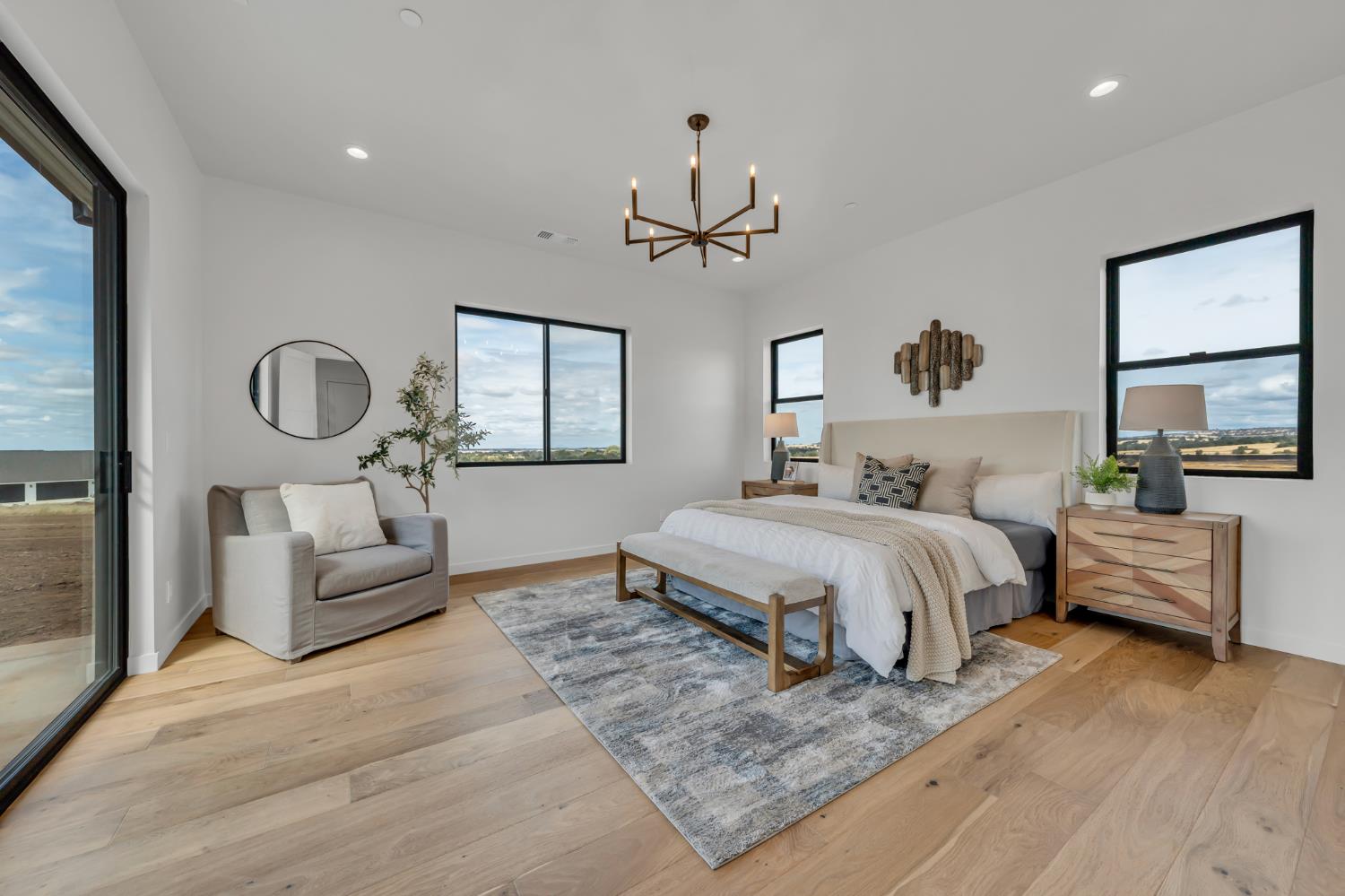 331 Big Ben Road Lincoln, CA 95648 - Photo 29 of 79 a spacious bedroom with a bed a couch and dresser