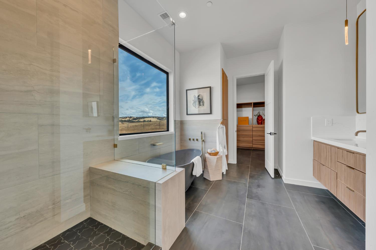 331 Big Ben Road Lincoln, CA 95648 - Photo 34 of 79 a spacious bathroom with a double vanity sink a mirror and a bathtub