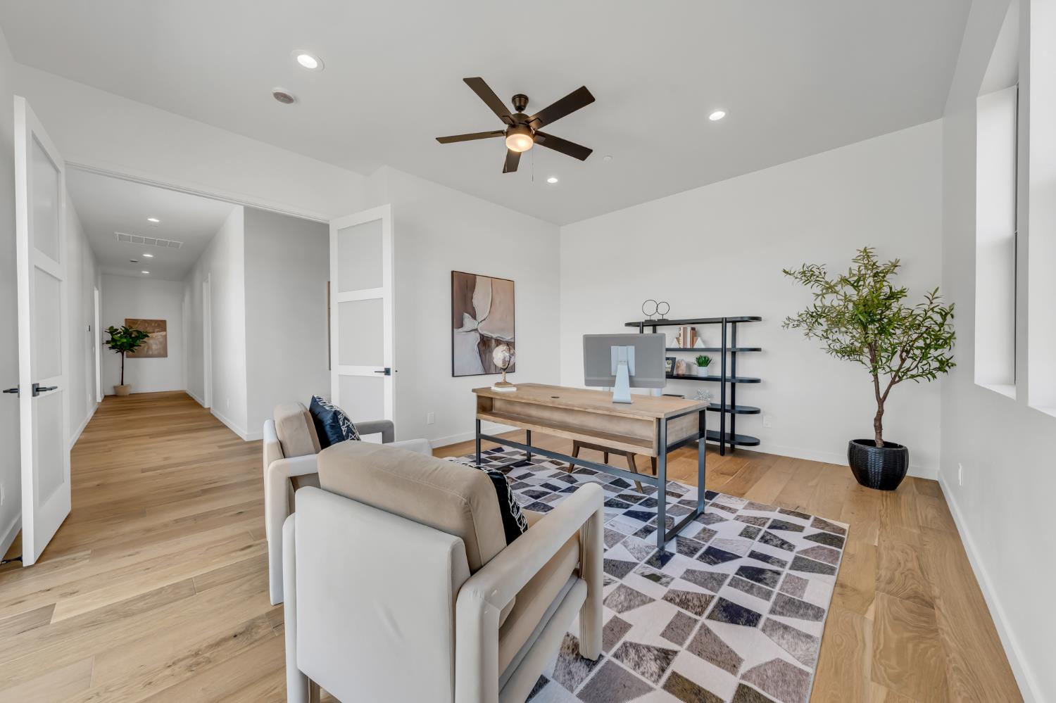 331 Big Ben Road Lincoln, CA 95648 - Photo 42 of 79 a living room with a couch and a potted plant