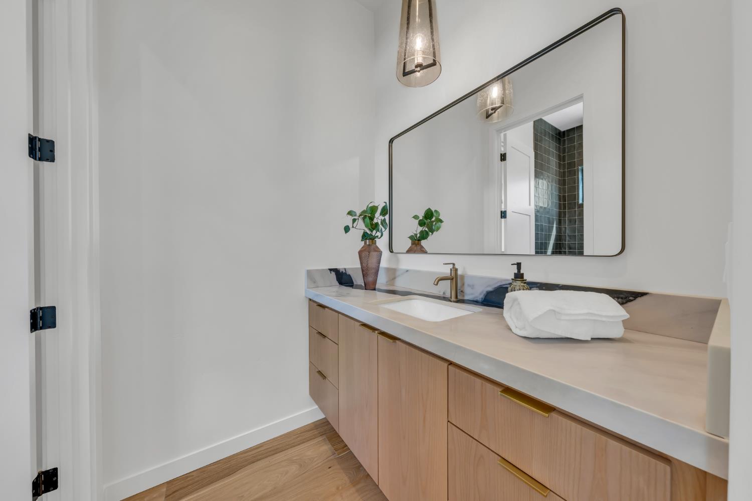331 Big Ben Road Lincoln, CA 95648 - Photo 45 of 79 a bathroom with a granite countertop sink and a mirror