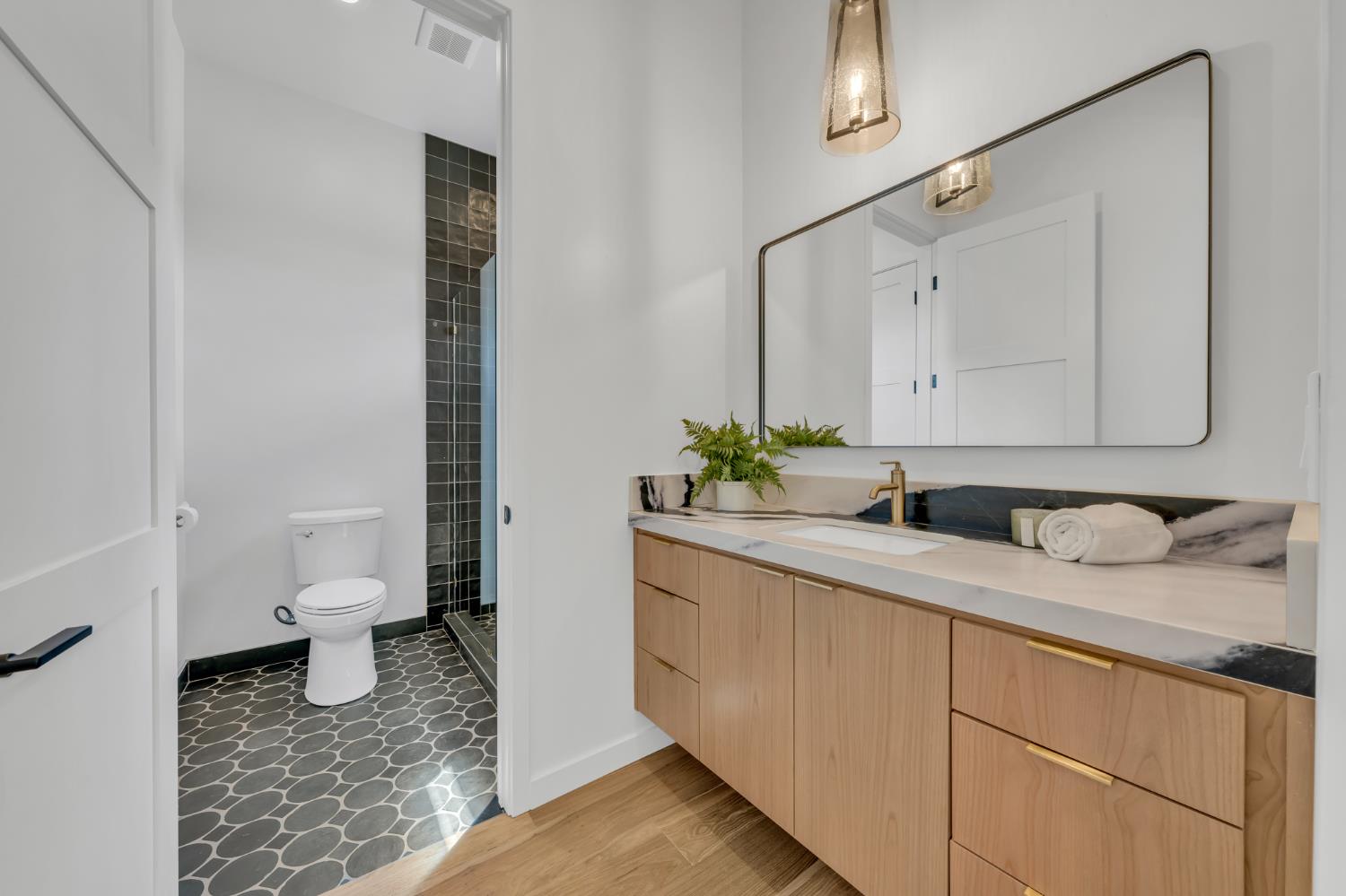 331 Big Ben Road Lincoln, CA 95648 - Photo 48 of 79 a bathroom with a granite countertop sink and a toilet