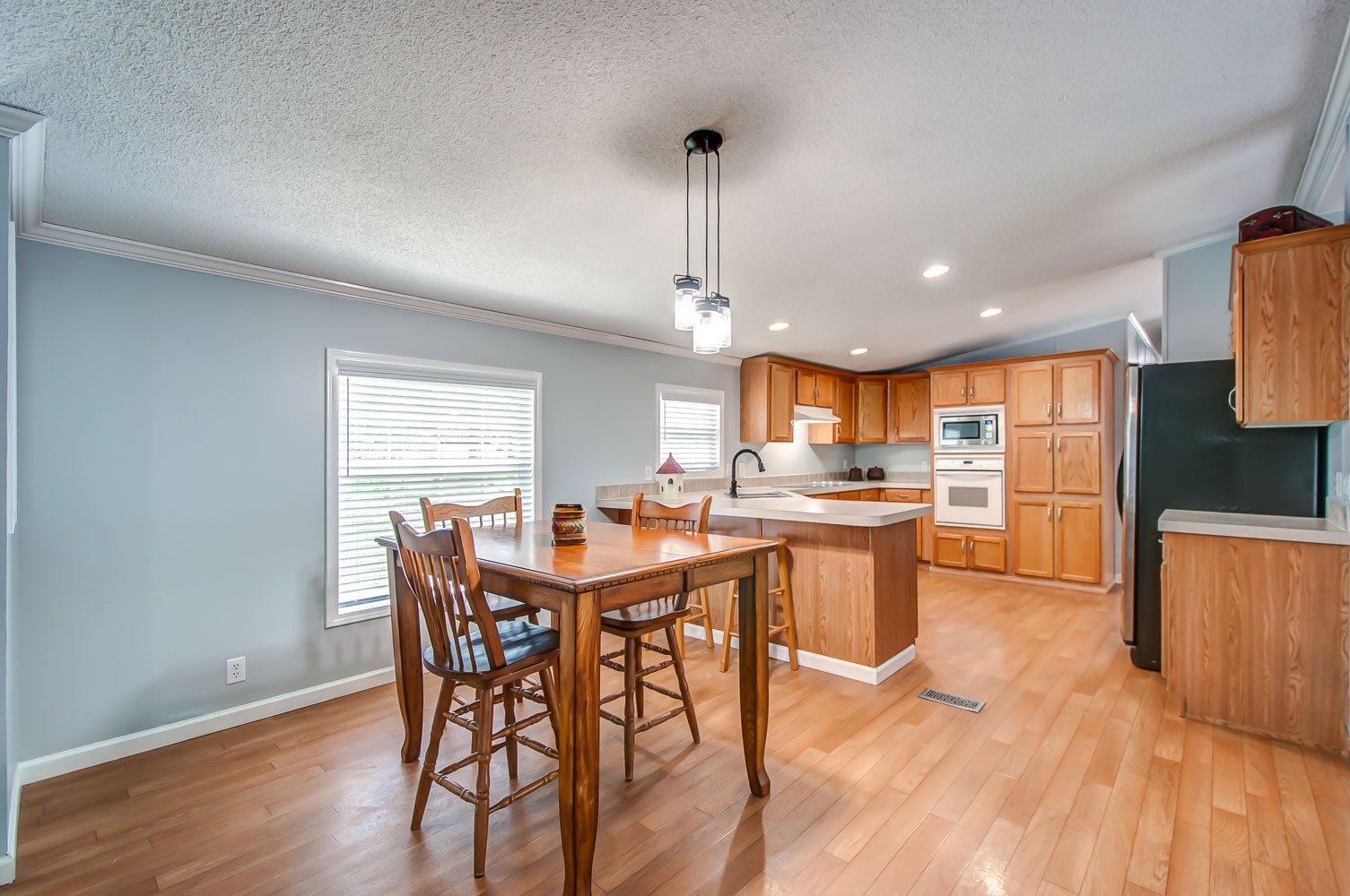 105 Fisher Road Dickson, TN 37055 - Photo 13 of 43 a large kitchen with a table and chairs