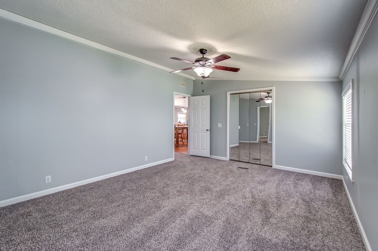 105 Fisher Road Dickson, TN 37055 - Photo 19 of 43 a view of a big room with chandelier fan and windows