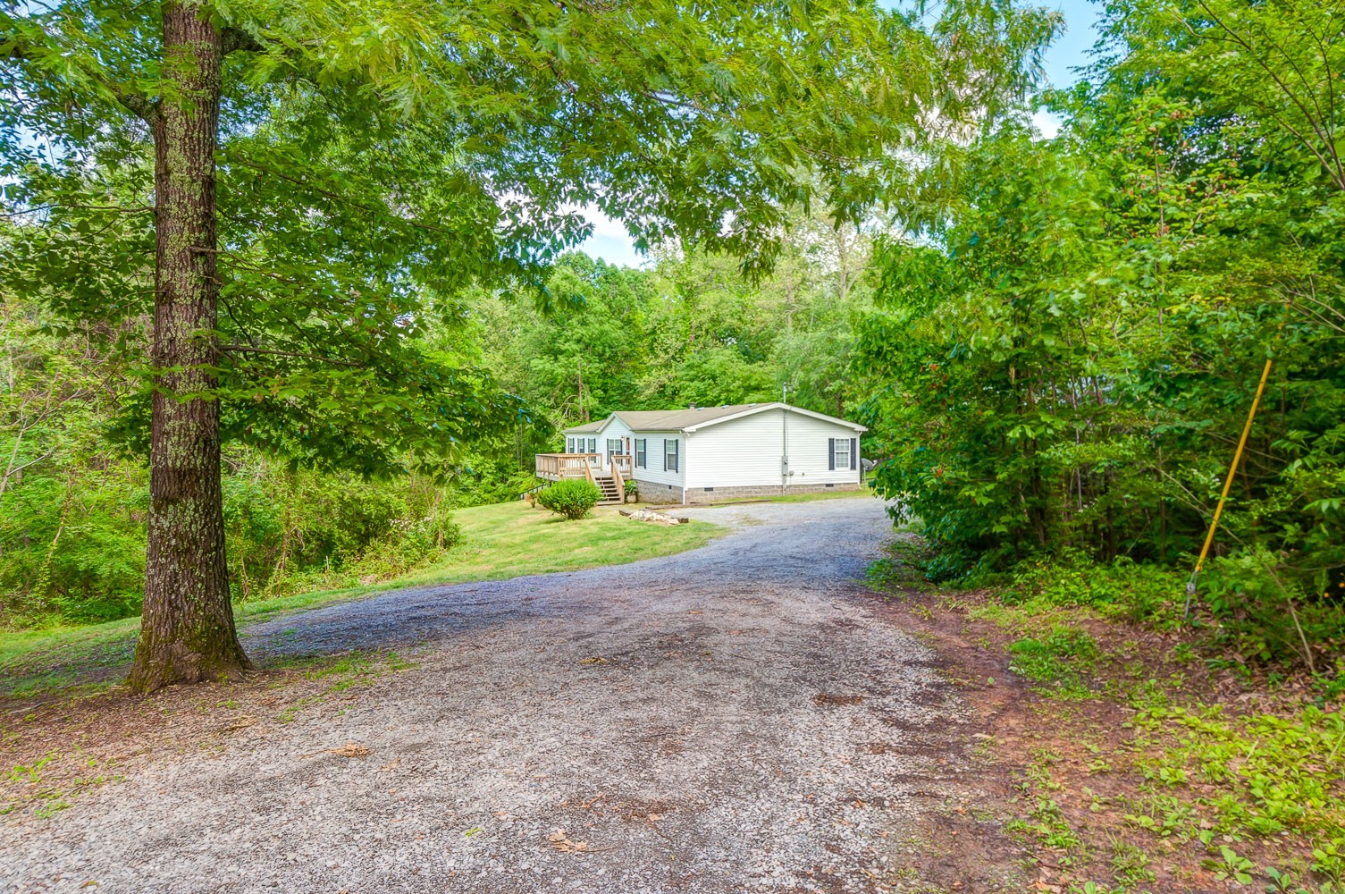 105 Fisher Road Dickson, TN 37055 - Photo 2 of 43 a small house with trees in front of it