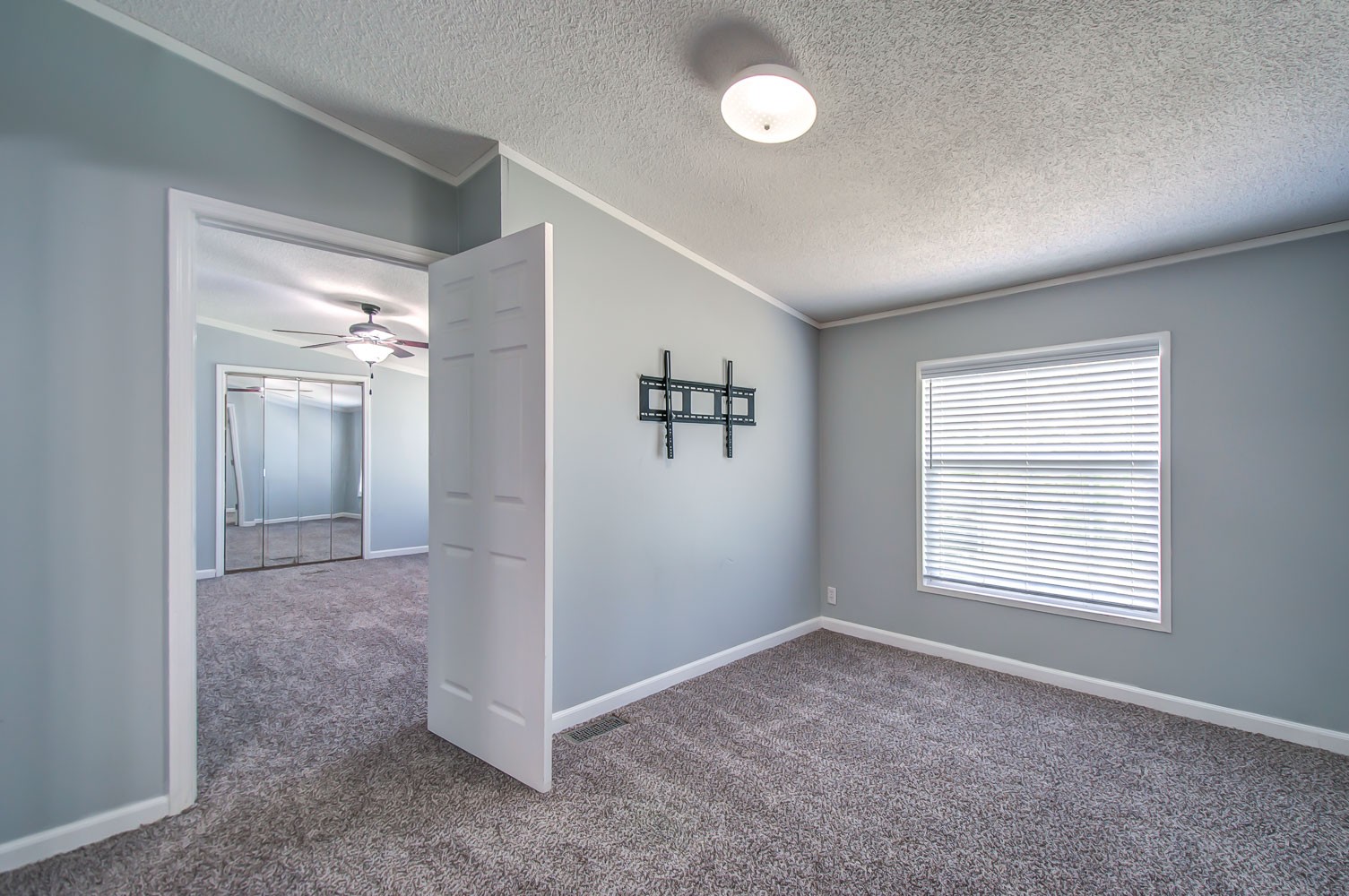 105 Fisher Road Dickson, TN 37055 - Photo 21 of 43 an empty room with windows and closet