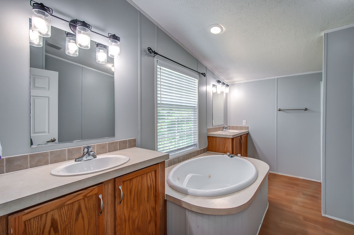 105 Fisher Road Dickson, TN 37055 - Photo 23 of 43 a bathroom with a sink a toilet a mirror and a tub