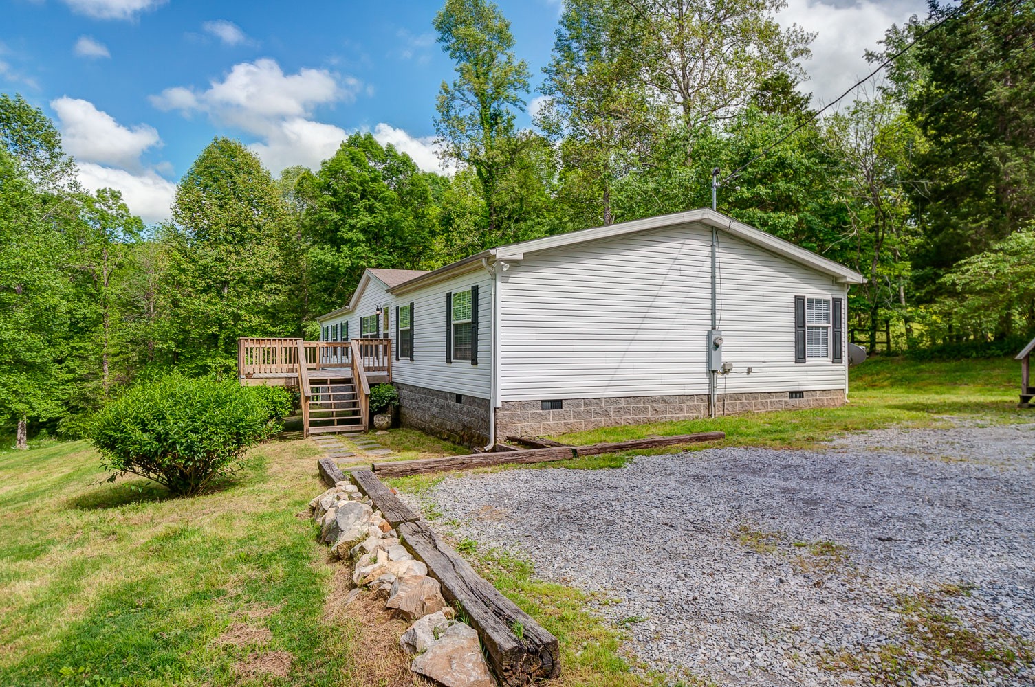 105 Fisher Road Dickson, TN 37055 - Photo 3 of 43 a view of house with backyard and trees