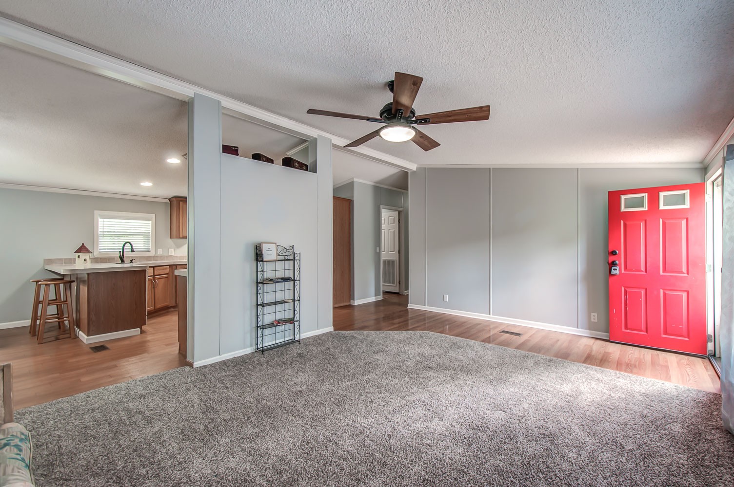 105 Fisher Road Dickson, TN 37055 - Photo 6 of 43 a view of a livingroom with a furniture wooden floor and a ceiling fan