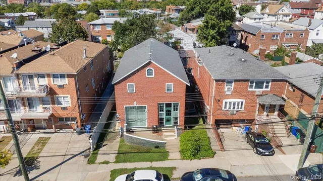 a front view of a residential apartment building with a yard