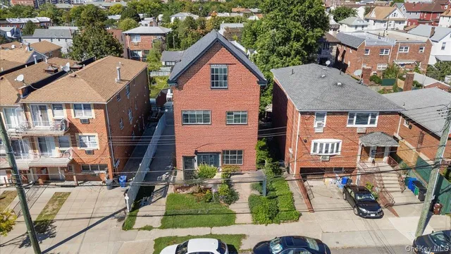 a front view of a residential apartment building with a yard