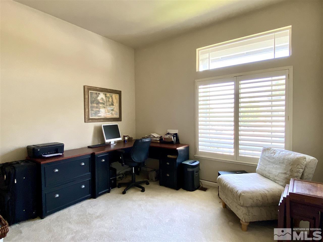 1486 Amston Road Reno, NV 89511 - Photo 13 of 18 a livingroom with workspace and a window
