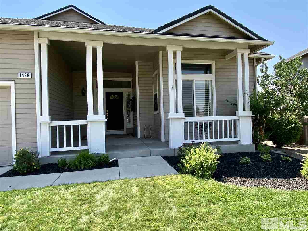 1486 Amston Road Reno, NV 89511 - Photo 3 of 18 front view of a house with a yard