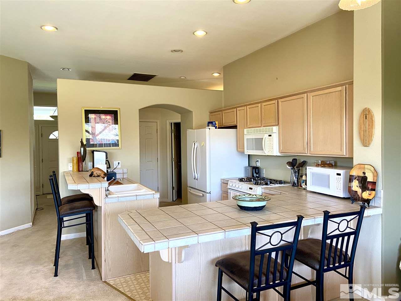 1486 Amston Road Reno, NV 89511 - Photo 8 of 18 a kitchen with a table and chairs in it