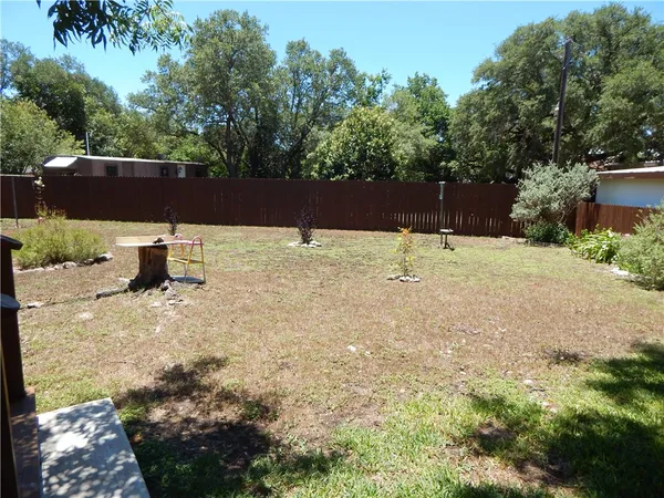 a backyard of a house with lots of green space