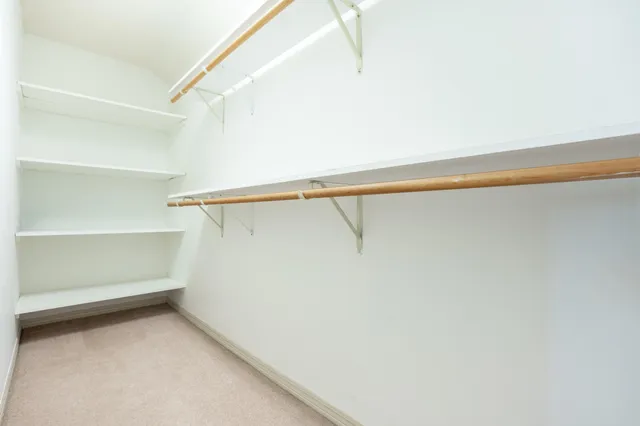 a view of an empty walk in closet