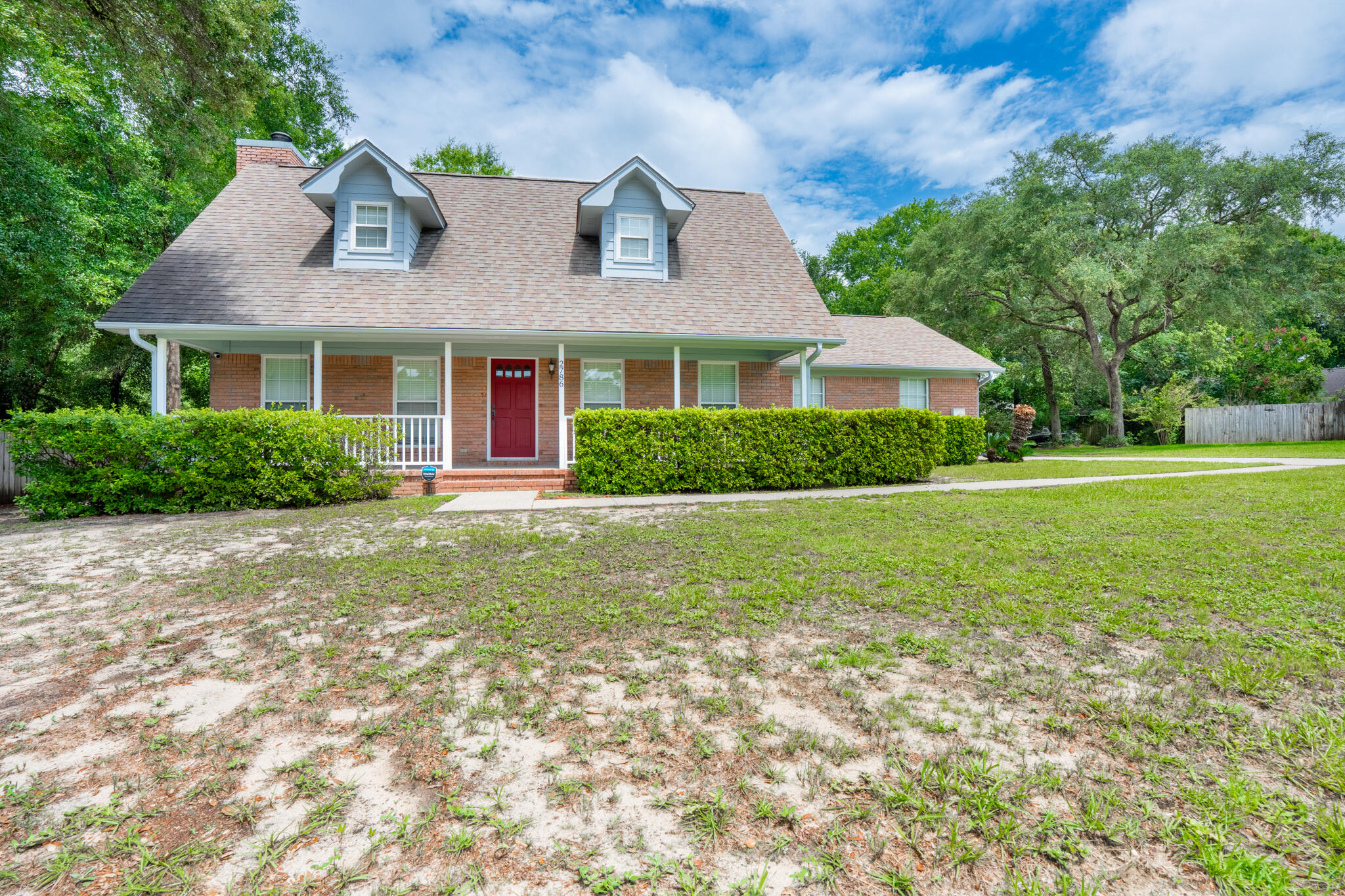 2786 Willow Bend Court Crestview, FL 32539 - Photo 2 of 32 a front view of house with yard and green space