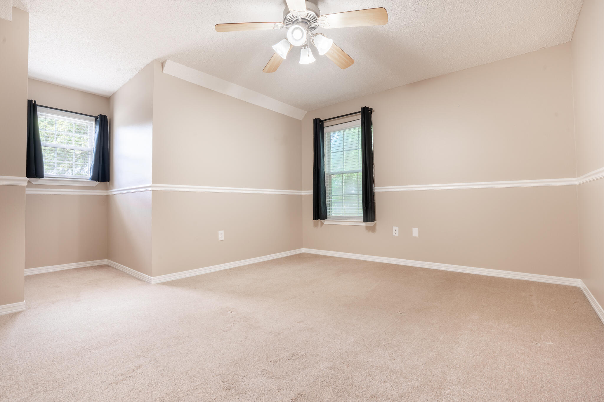 2786 Willow Bend Court Crestview, FL 32539 - Photo 21 of 32 an empty room with chandelier fan and windows