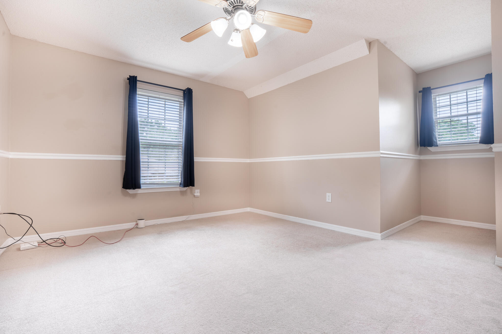 2786 Willow Bend Court Crestview, FL 32539 - Photo 22 of 32 an empty room with windows and chandelier fan