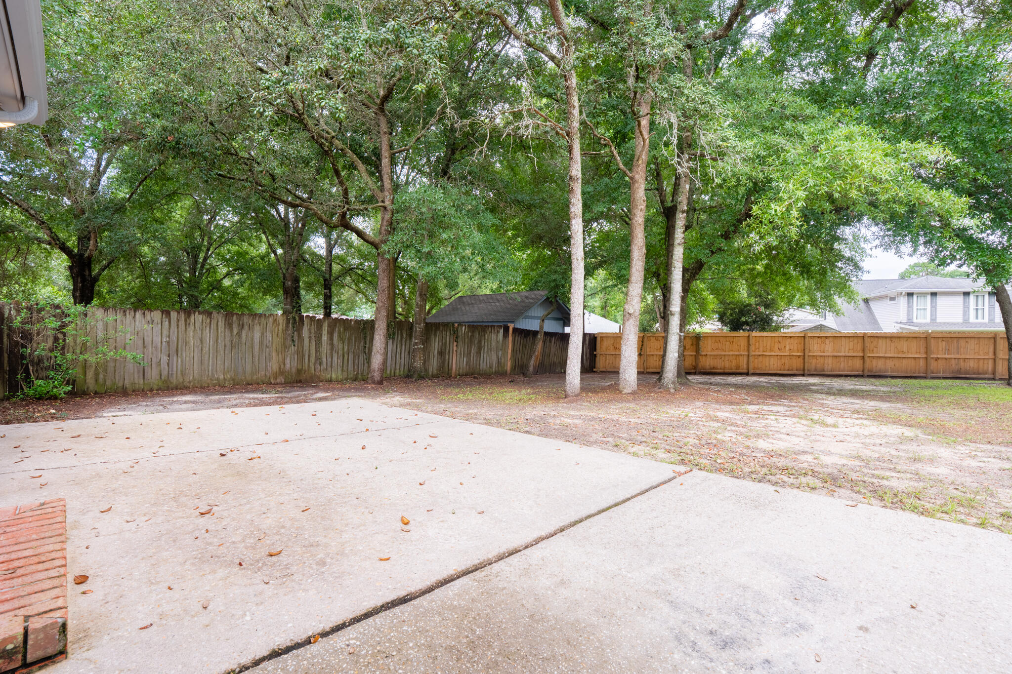 2786 Willow Bend Court Crestview, FL 32539 - Photo 27 of 32 a backyard of a house with lots of green space