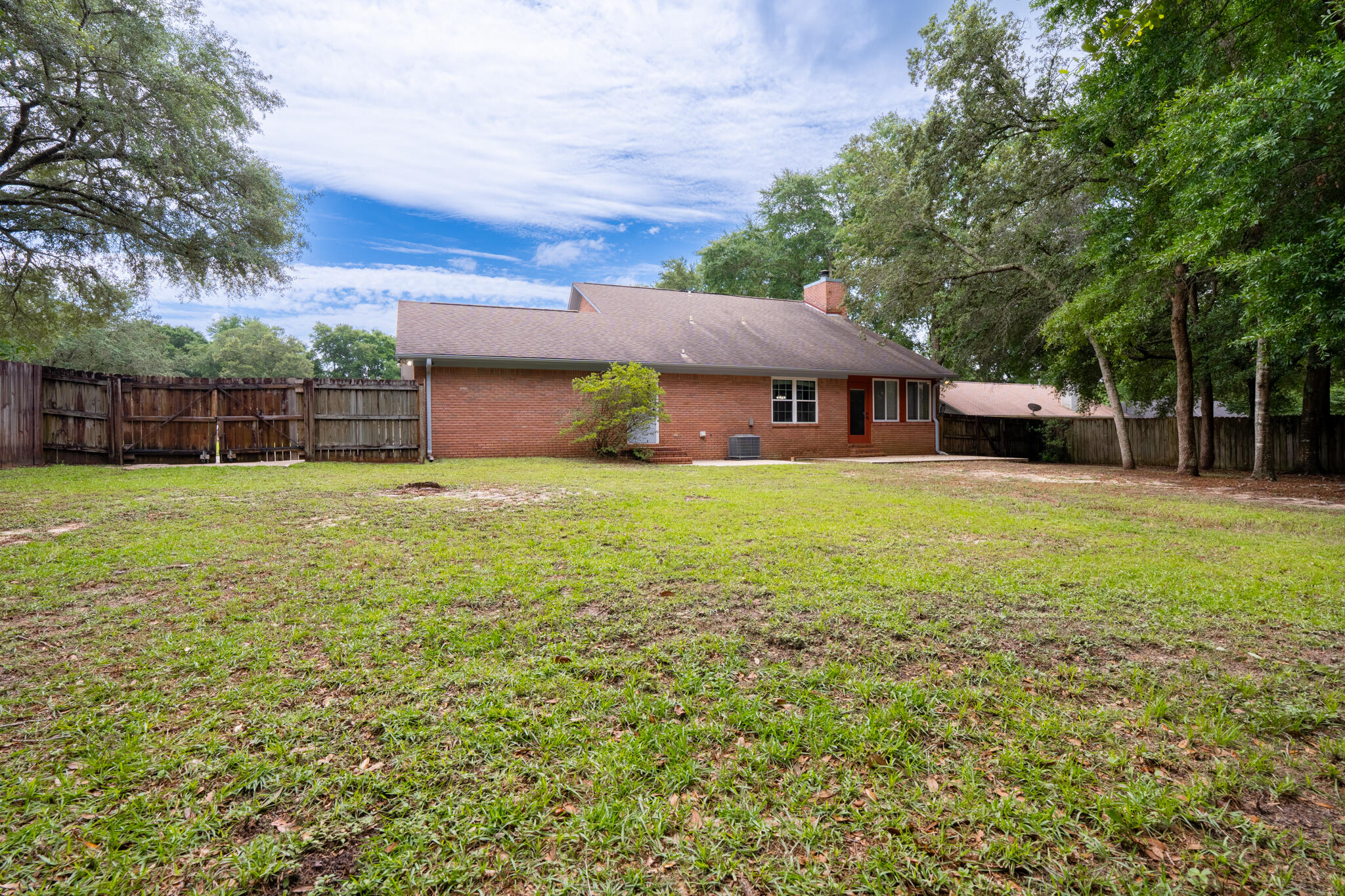 2786 Willow Bend Court Crestview, FL 32539 - Photo 30 of 32 a view of a house with a yard and sitting area