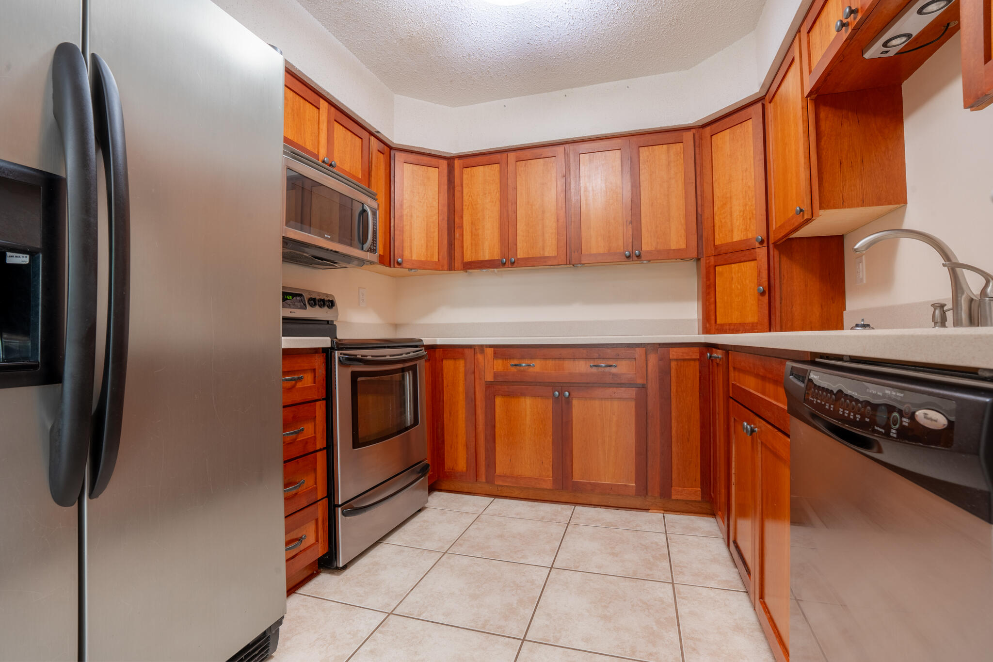 2786 Willow Bend Court Crestview, FL 32539 - Photo 9 of 32 a kitchen with stainless steel appliances granite countertop a stove and a refrigerator
