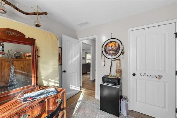 a view of a livingroom with furniture and tub