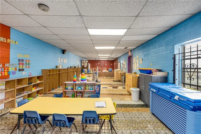 a dining room with lots of furniture and a wooden floor