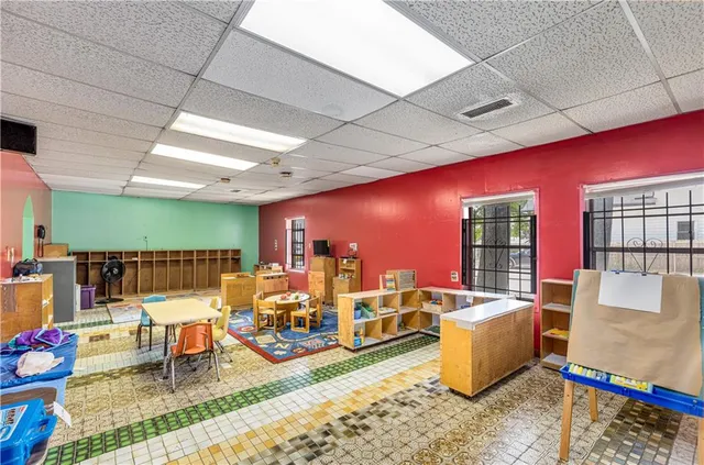 a living room with lots of furniture and a table
