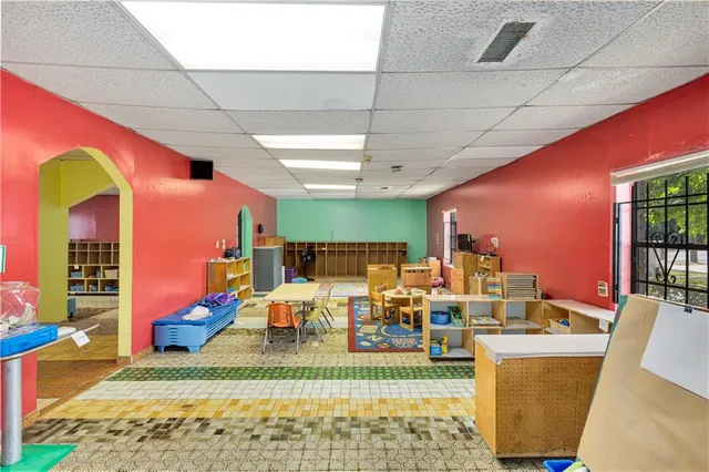 a living room with lots of furniture and a rug