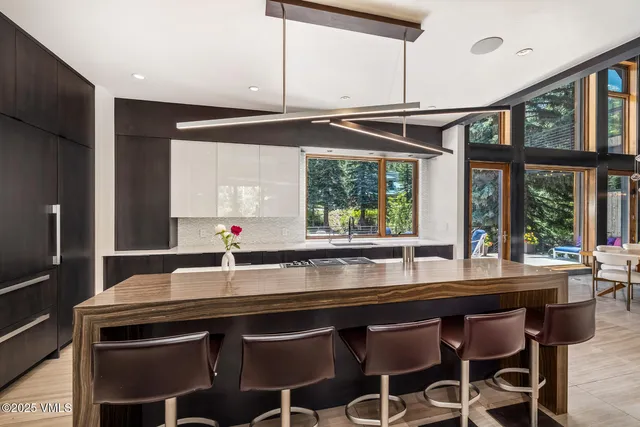 a kitchen with a sink cabinets and window