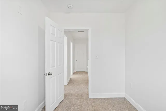 a view of a room with a hallway