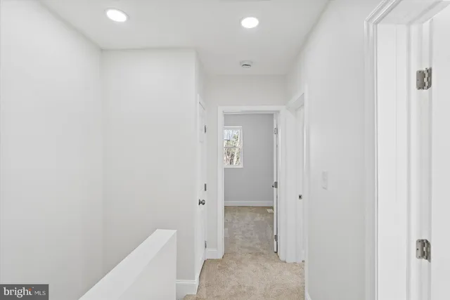 a spacious bathroom with a granite countertop sink