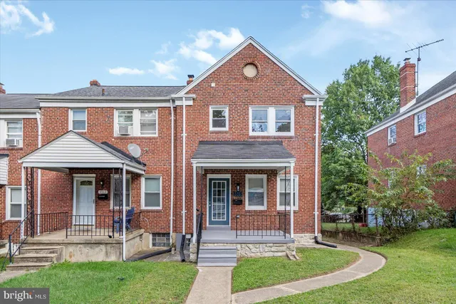 front view of a house with a yard