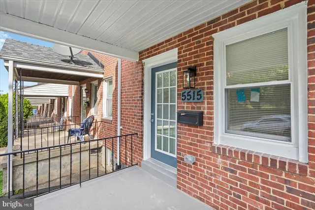 a view of a brick house with a large window
