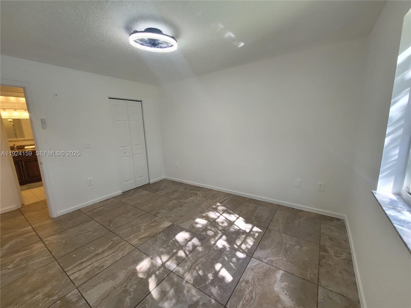 2133 Renaissance Boulevard, Unit 306 Miramar, FL 33025 - Photo 13 of 32 a view of a livingroom with a window