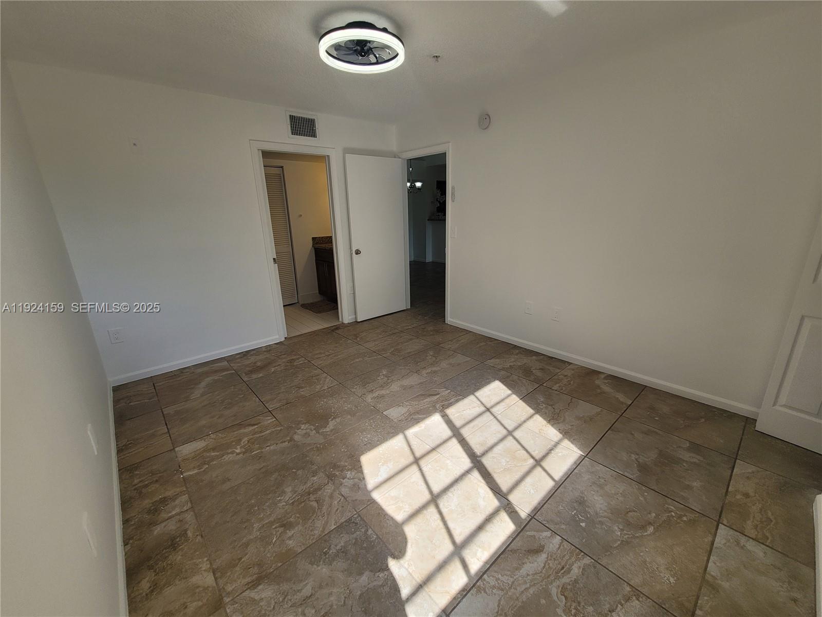2133 Renaissance Boulevard, Unit 306 Miramar, FL 33025 - Photo 15 of 32 an empty room with a outdoor space