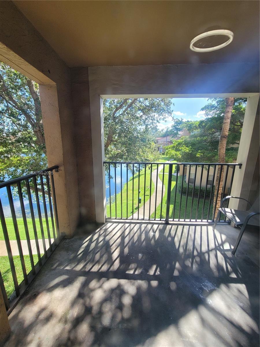 2133 Renaissance Boulevard, Unit 306 Miramar, FL 33025 - Photo 32 of 32 a view of a patio with a yard