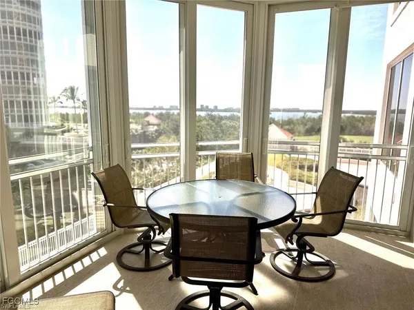 a view of a dining room with furniture window and outside view