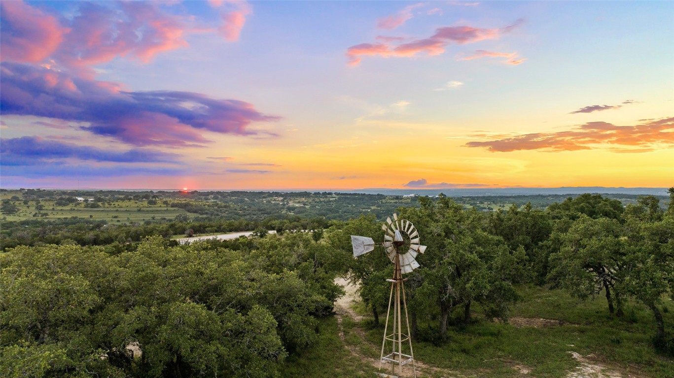 Lot 9 Stanton Road Johnson City, TX 78636 - Photo 4 of 14 a view of a city with lush green forest