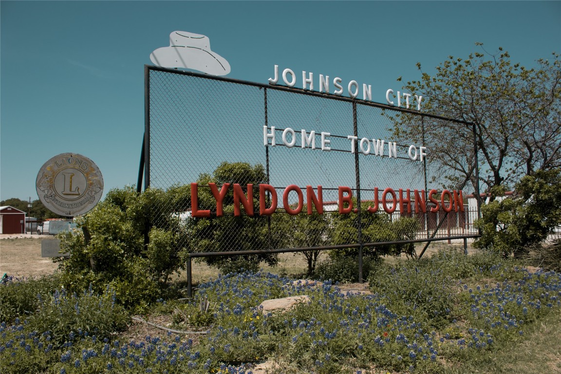 Lot 9 Stanton Road Johnson City, TX 78636 - Photo 10 of 14 a sign on the side of a building